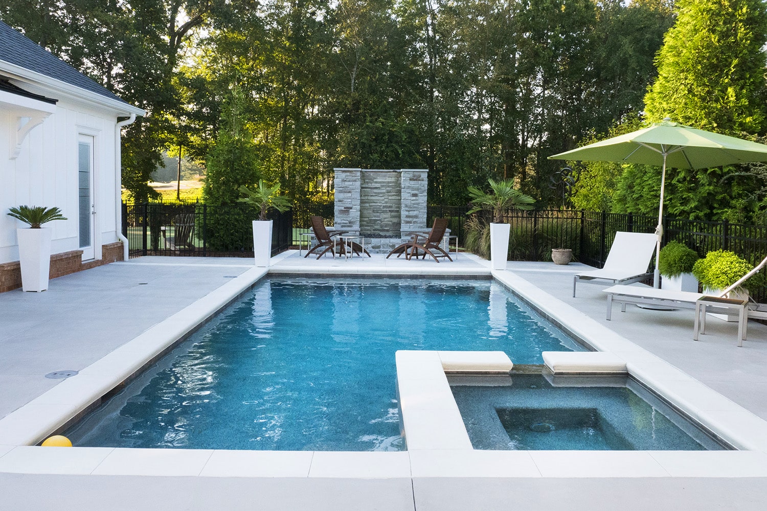 backyard swimming pool with spa